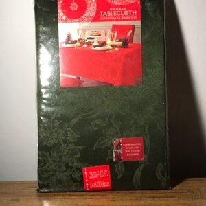 Damask Christmas Ribbon tablecloth. Size 52 x 70 oblong . Color is green